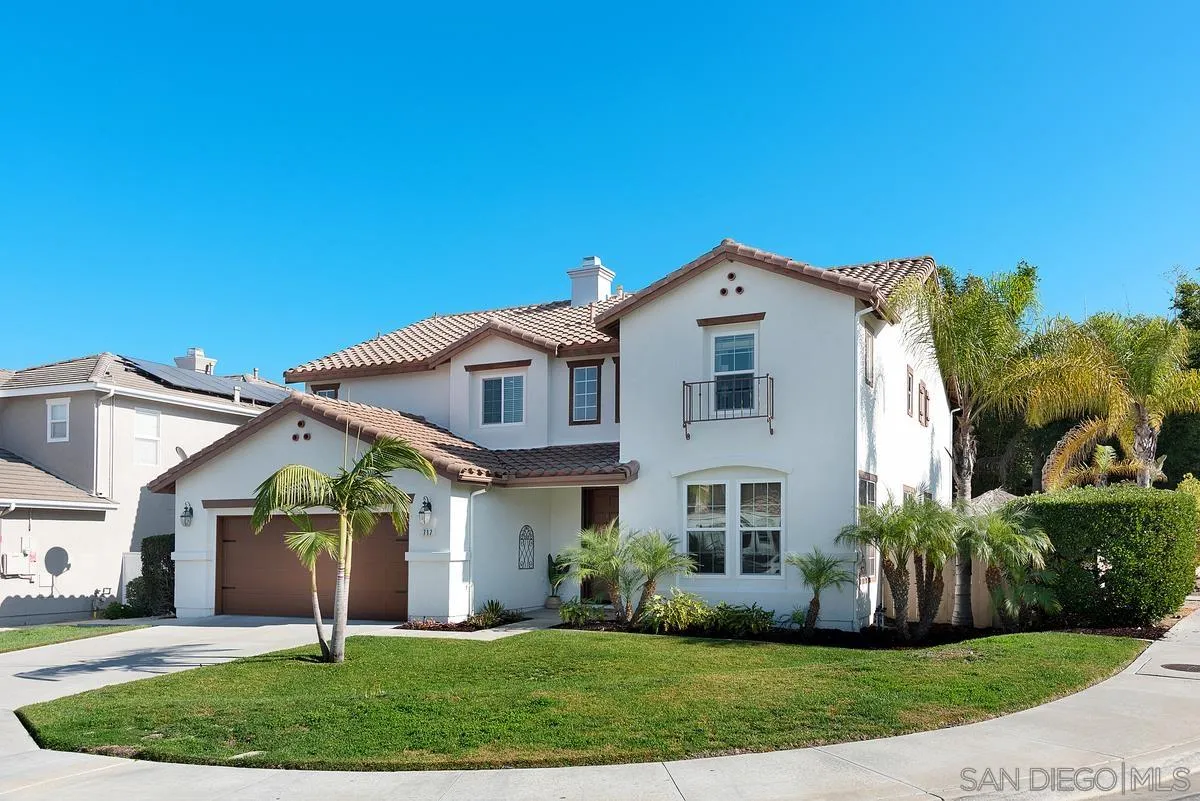 717 Via Cafetal San Marcos, CA 92069 - Photo 13 of 41 a front view of a house with a yard