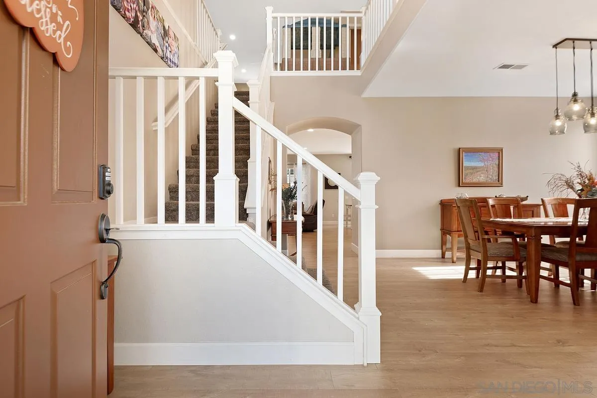 717 Via Cafetal San Marcos, CA 92069 - Photo 15 of 41 a view of a dining room with furniture window and wooden floor