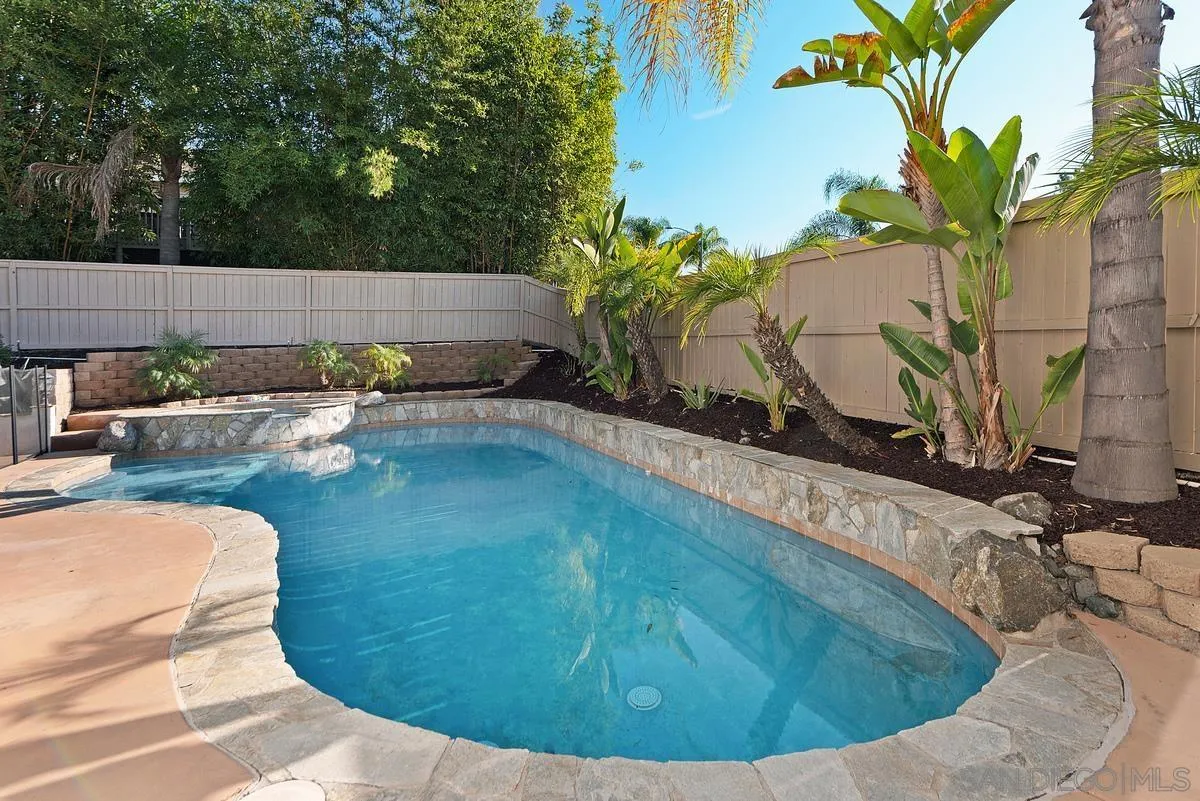 717 Via Cafetal San Marcos, CA 92069 - Photo 2 of 41 a view of a swimming pool with a yard