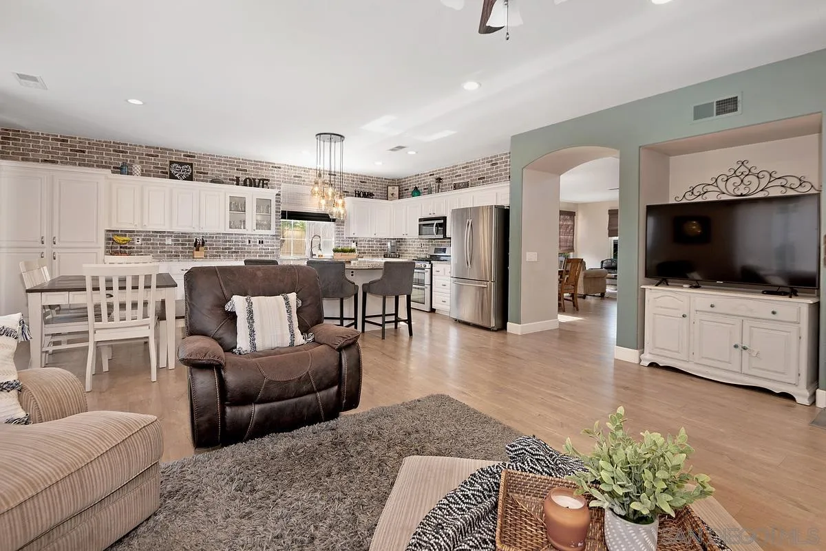 717 Via Cafetal San Marcos, CA 92069 - Photo 21 of 41 a living room with furniture and a flat screen tv