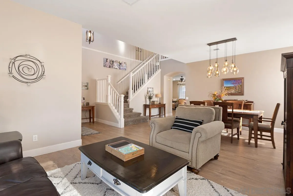 717 Via Cafetal San Marcos, CA 92069 - Photo 26 of 41 a living room with furniture and a chandelier