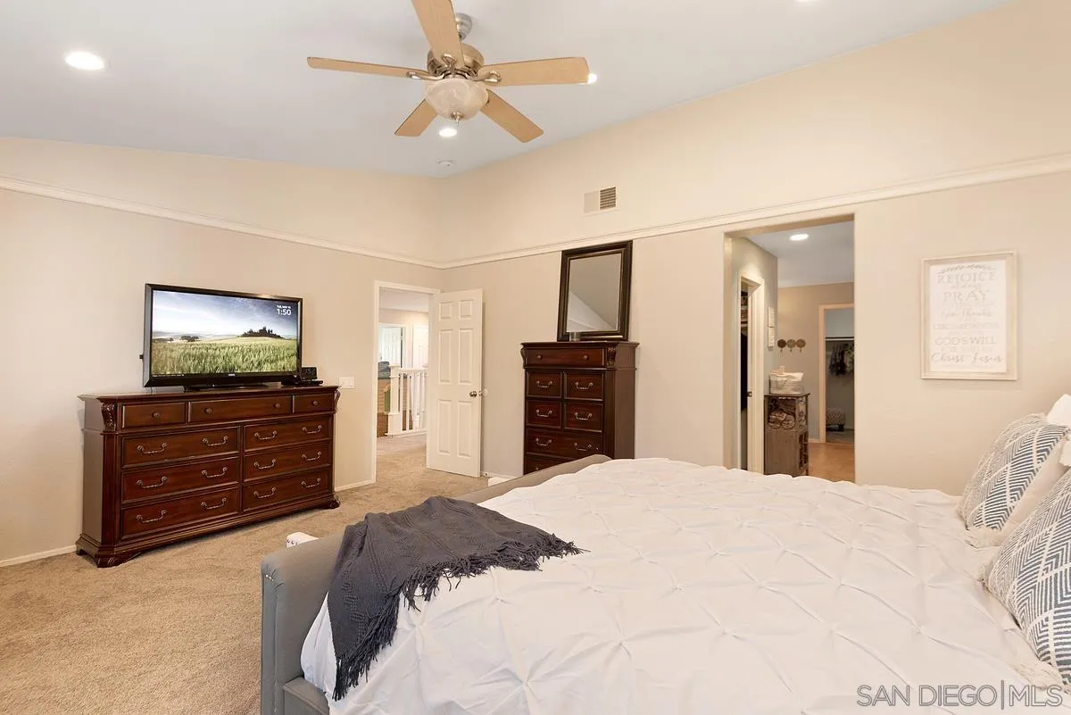 717 Via Cafetal San Marcos, CA 92069 - Photo 35 of 41 a bedroom with a bed and a dresser