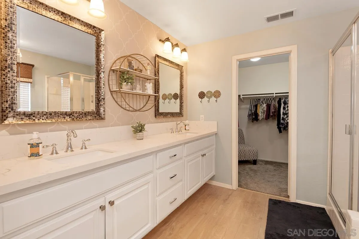 717 Via Cafetal San Marcos, CA 92069 - Photo 36 of 41 a en suite bathroom with a sink and a mirror