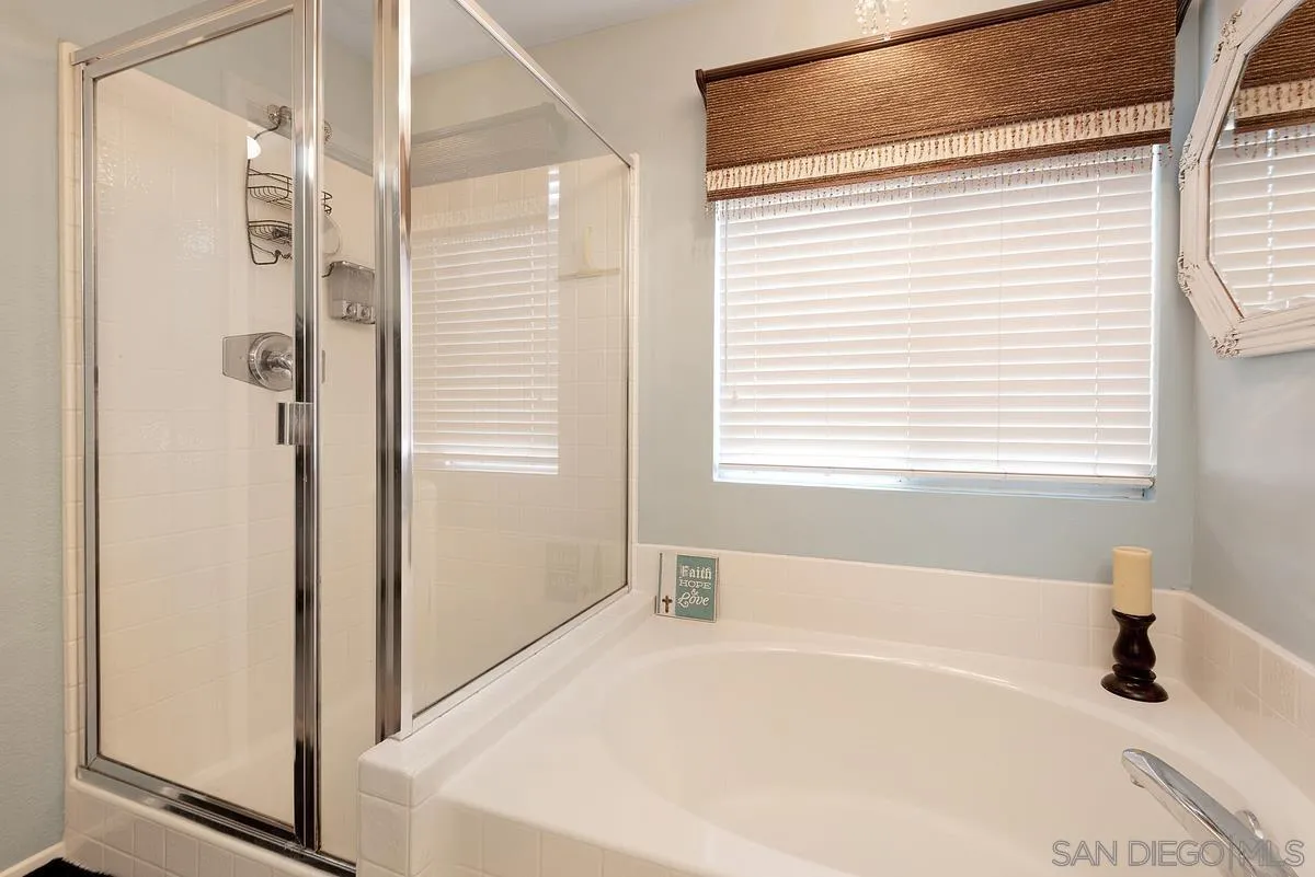 717 Via Cafetal San Marcos, CA 92069 - Photo 37 of 41 a bathroom with a bathtub and a shower