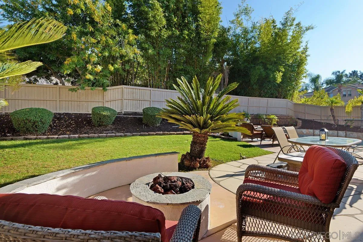 717 Via Cafetal San Marcos, CA 92069 - Photo 8 of 41 a view of a backyard with plants and outdoor seating