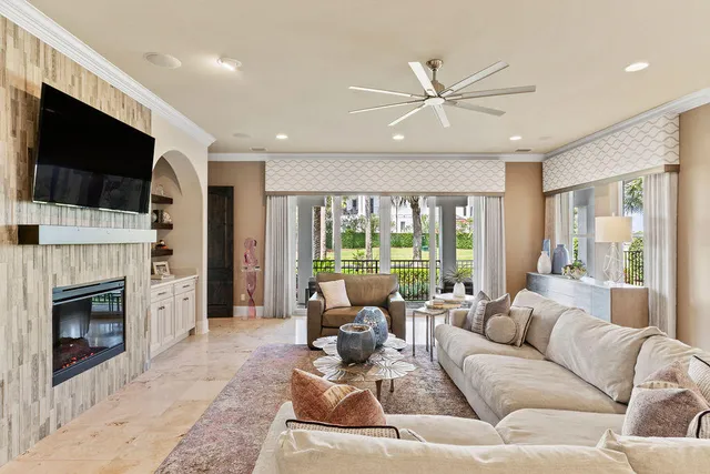 a kitchen with stainless steel appliances granite countertop a stove top oven a sink a dining table and chairs