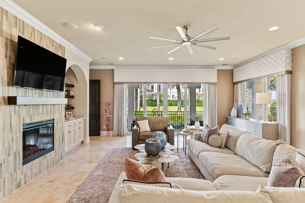 20 St Barts Bay Destin, FL 32541 - Photo 11 of 93 a living room with furniture a fireplace and a flat screen tv