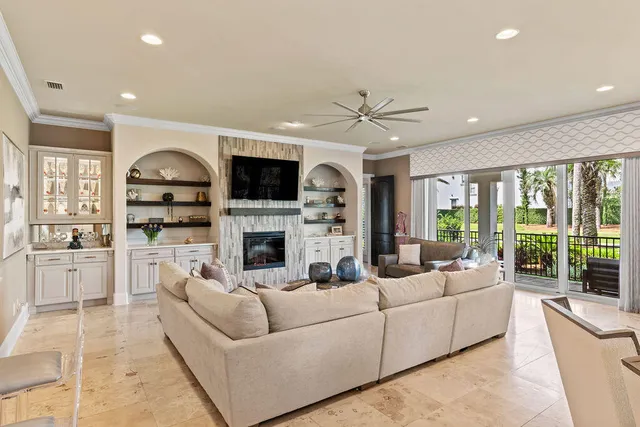 a room with pool table and windows