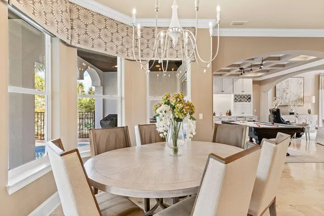 a view of a dining room with furniture window and outside view