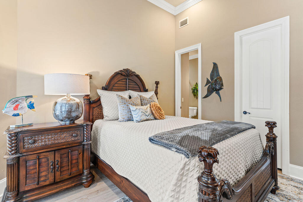 20 St Barts Bay Destin, FL 32541 - Photo 32 of 93 a bedroom with a bed and a dresser