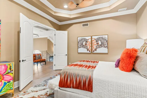 a front view of multi story residential apartment building with garden