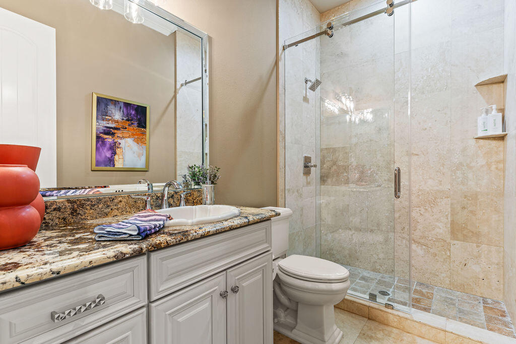 20 St Barts Bay Destin, FL 32541 - Photo 36 of 93 a bathroom with a granite countertop sink toilet and shower