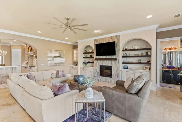a living room with furniture fireplace and flat screen tv