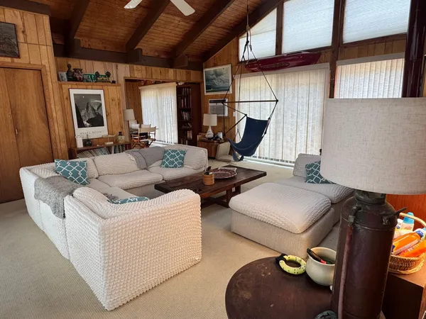 a living room with furniture and a window