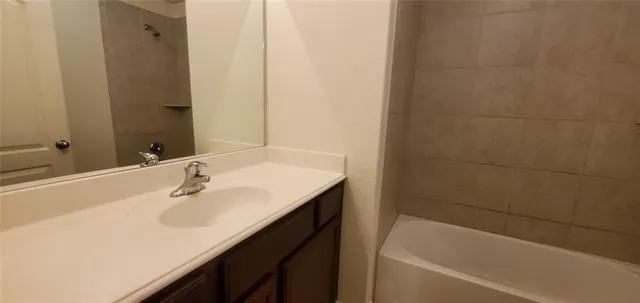 a bathroom with a sink and a bathtub