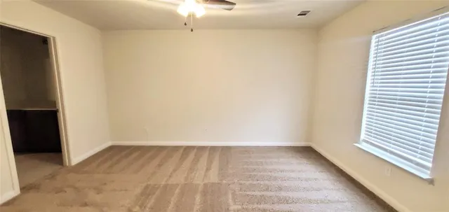 a view of room with window and hardwood floor