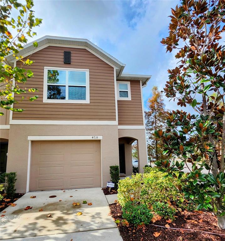 4718 Legendary Oak Street Tampa, FL 33610 - Photo 1 of 21 a front view of house with yard
