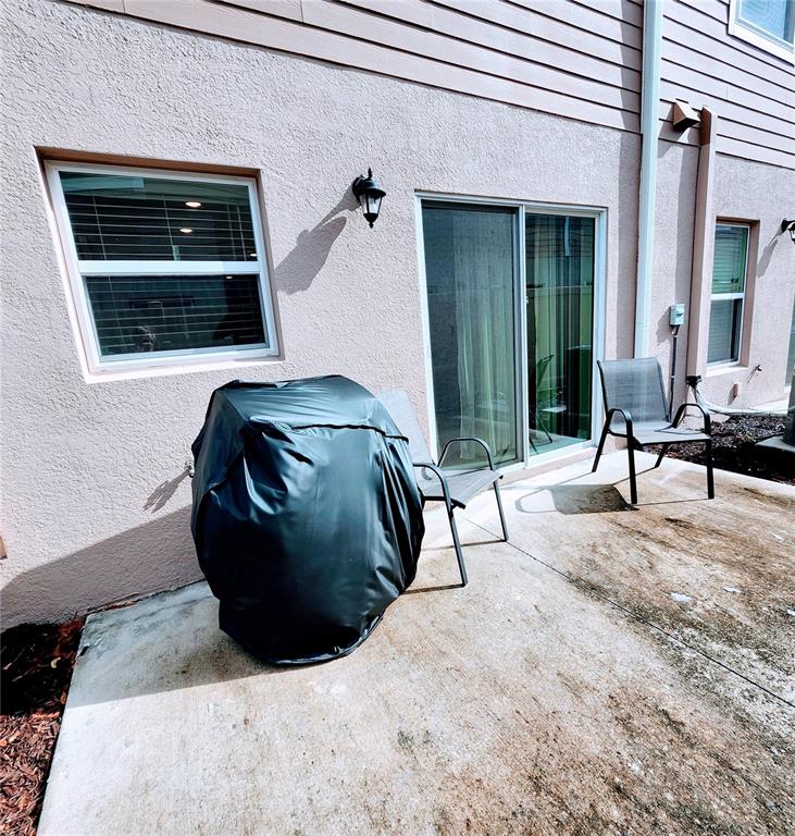 4718 Legendary Oak Street Tampa, FL 33610 - Photo 19 of 21 a living room with a bed and a window