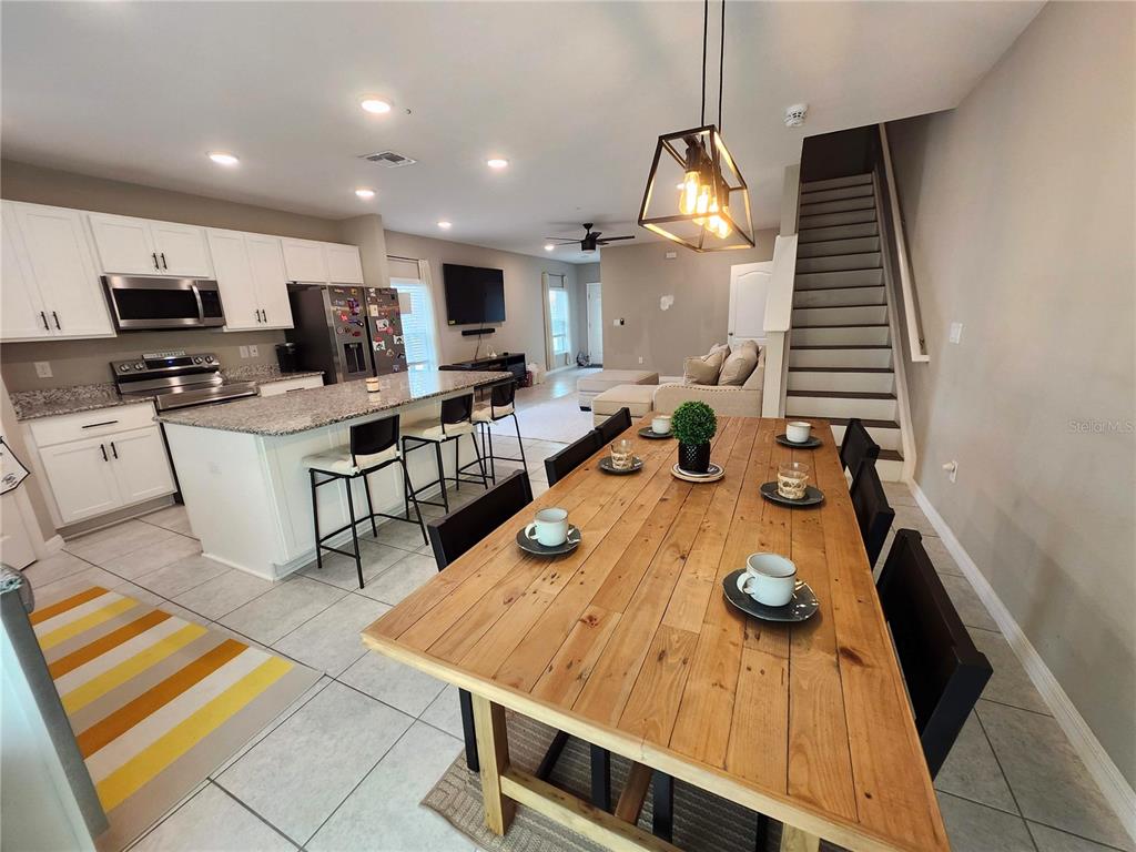 4718 Legendary Oak Street Tampa, FL 33610 - Photo 5 of 21 a large kitchen with a table and chairs