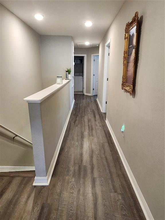 4718 Legendary Oak Street Tampa, FL 33610 - Photo 8 of 21 a view of a hallway with wooden floor