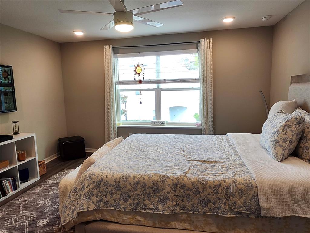 4718 Legendary Oak Street Tampa, FL 33610 - Photo 10 of 21 a bedroom with a bed and a window