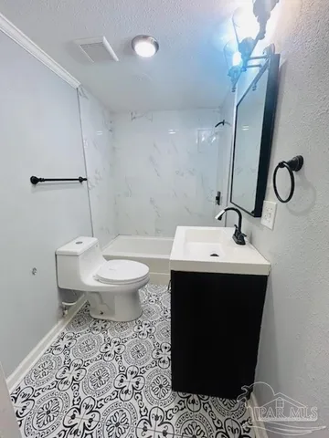 a bathroom with a sink toilet and mirror