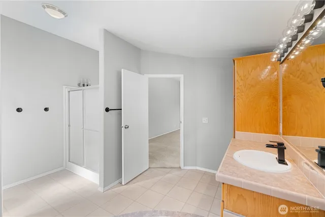 a bathroom with a sink and a mirror