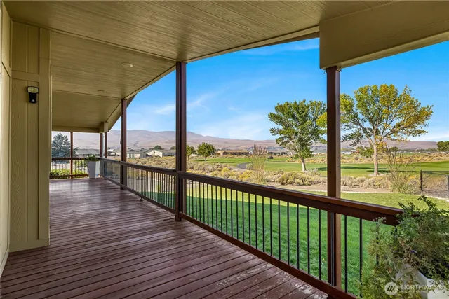 a view of balcony with wooden floor