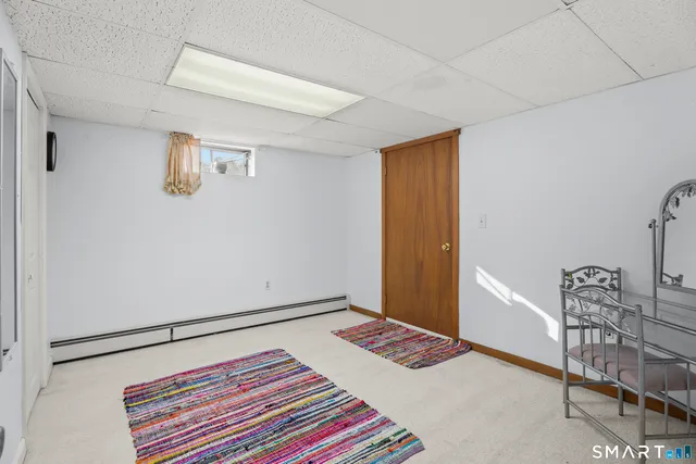 a bathroom with a toilet sink and shower