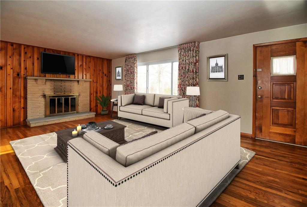 3133 Robinson Run Road McDonald, PA 15057 - Photo 3 of 24 The fireplace keeps the room cozy while also acting as a great focal point!