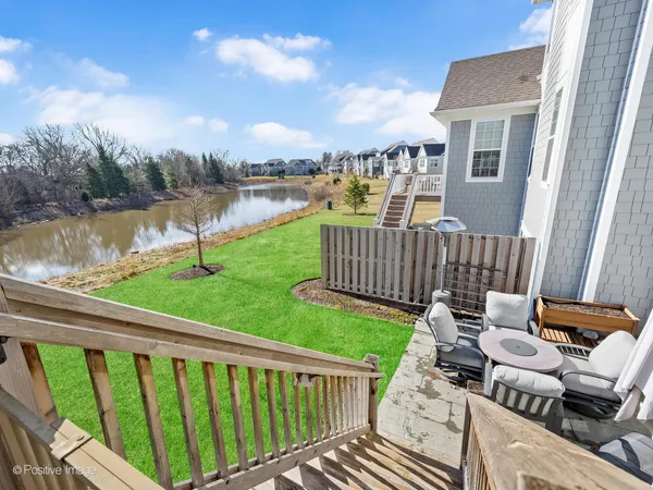 a view of a lake with houses in the back