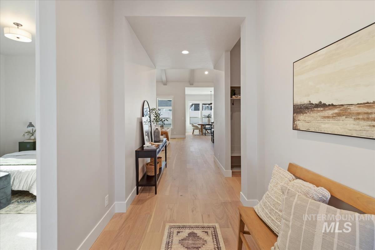 7355 Powell Place Eagle, ID 83714 - Photo 3 of 37 Hardwood-finish flooring throughout, featuring a recessed lighting design and white baseboards
