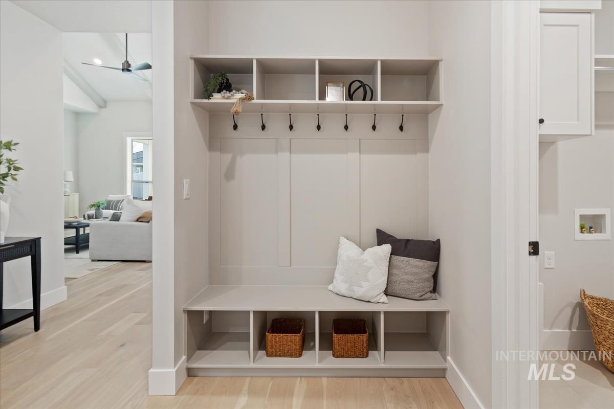 7355 Powell Place Eagle, ID 83714 - Photo 32 of 37 Built-in mudroom bench with cubby storage and coat hooks