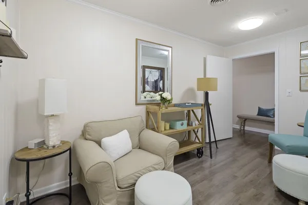 a bathroom with a granite countertop sink a toilet and mirror