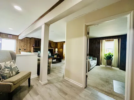 a view of kitchen with stainless steel appliances cabinets and wooden floor
