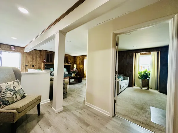 a view of kitchen with stainless steel appliances cabinets and wooden floor