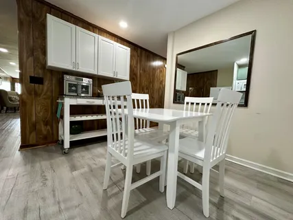 a bathroom with a sink a toilet and mirror