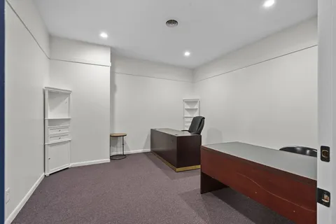 a workspace with furniture and a window