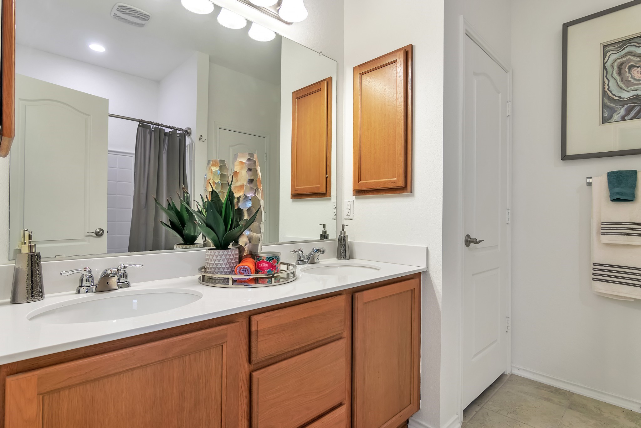 1075 Toltec Trail Georgetown, TX 78626 - Photo 17 of 32 a bathroom with a sink double vanity and a mirror