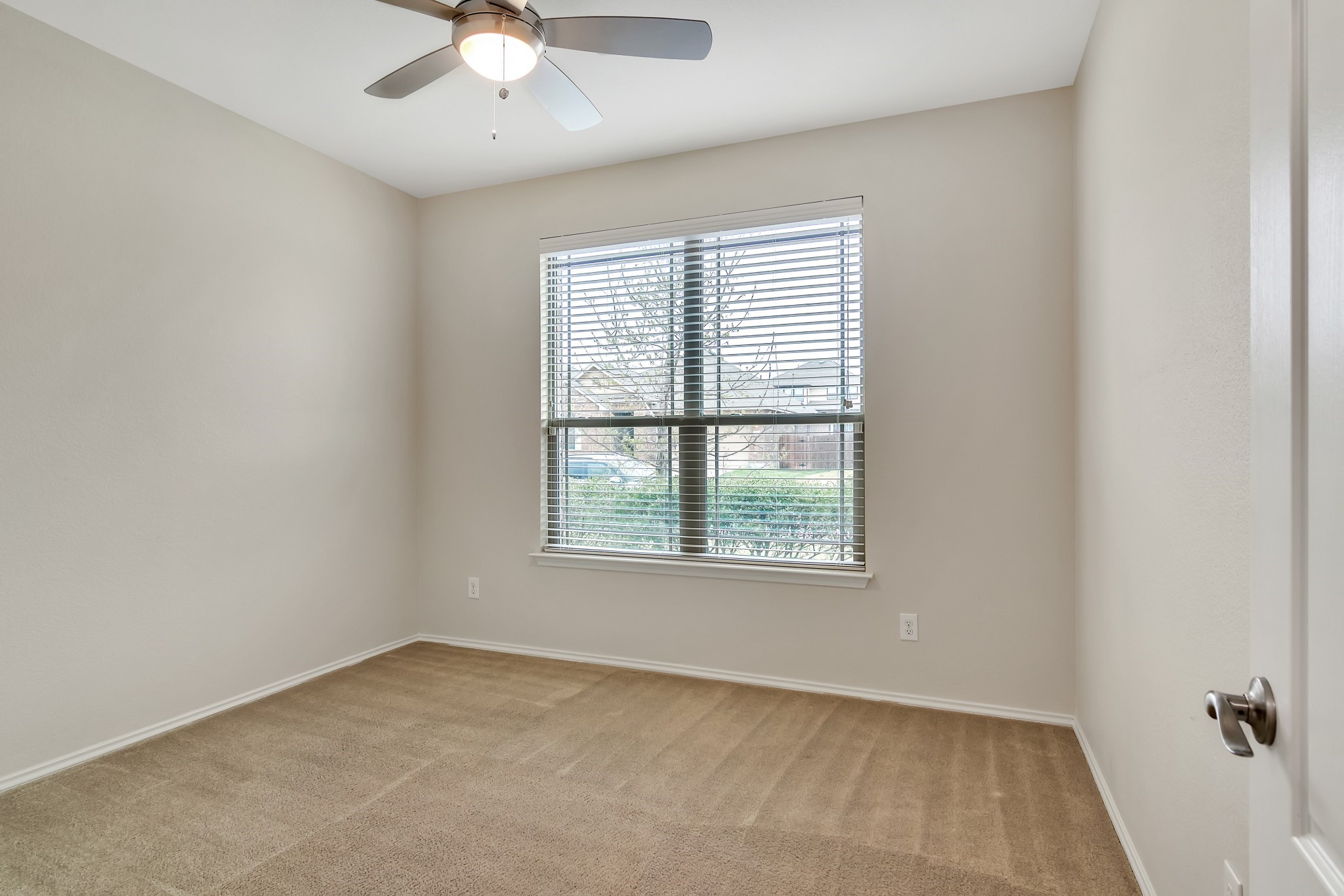 1075 Toltec Trail Georgetown, TX 78626 - Photo 24 of 32 an empty room with a window and a fan