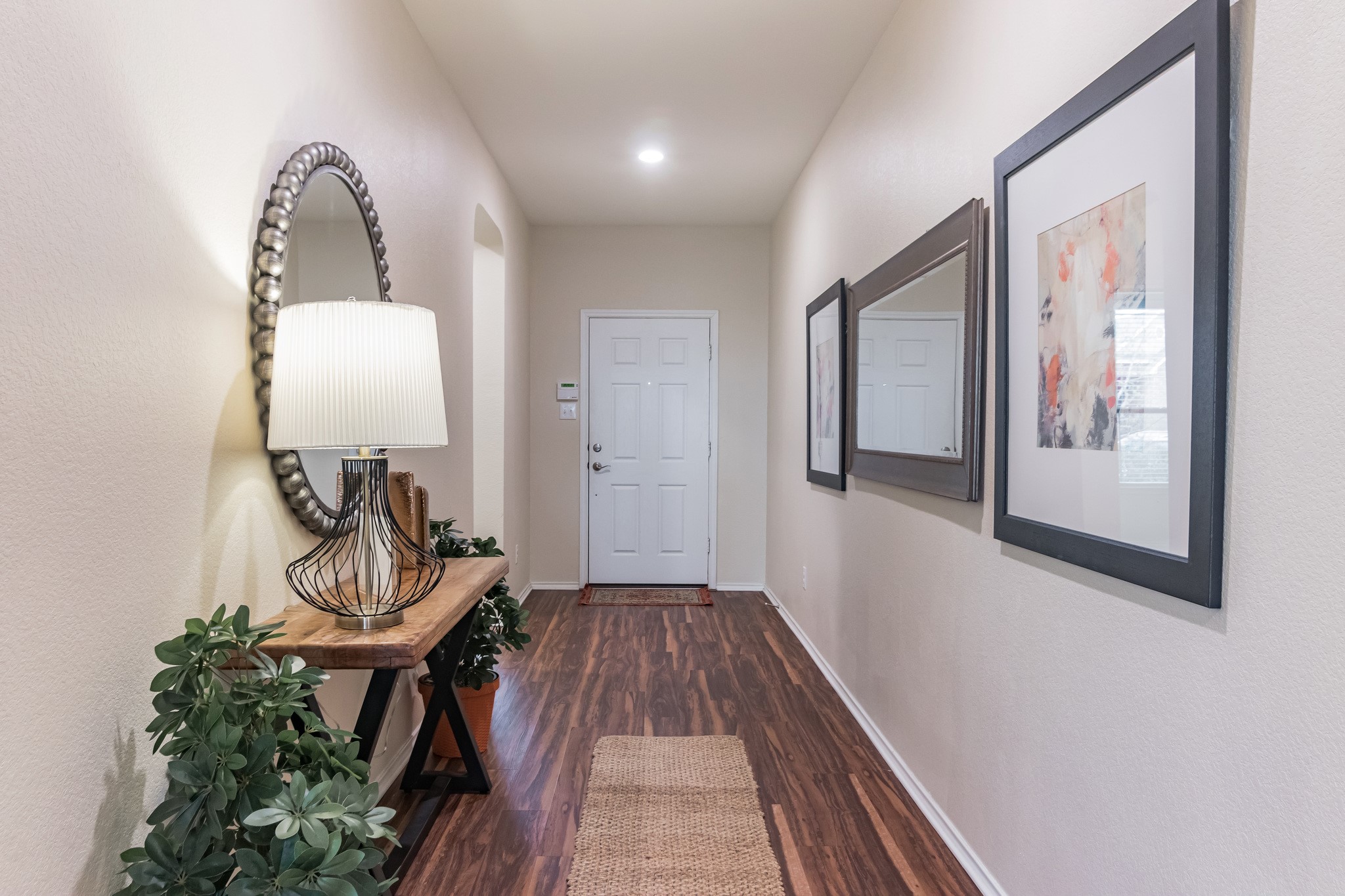 1075 Toltec Trail Georgetown, TX 78626 - Photo 26 of 32 a view of a livingroom with wooden floor and furniture