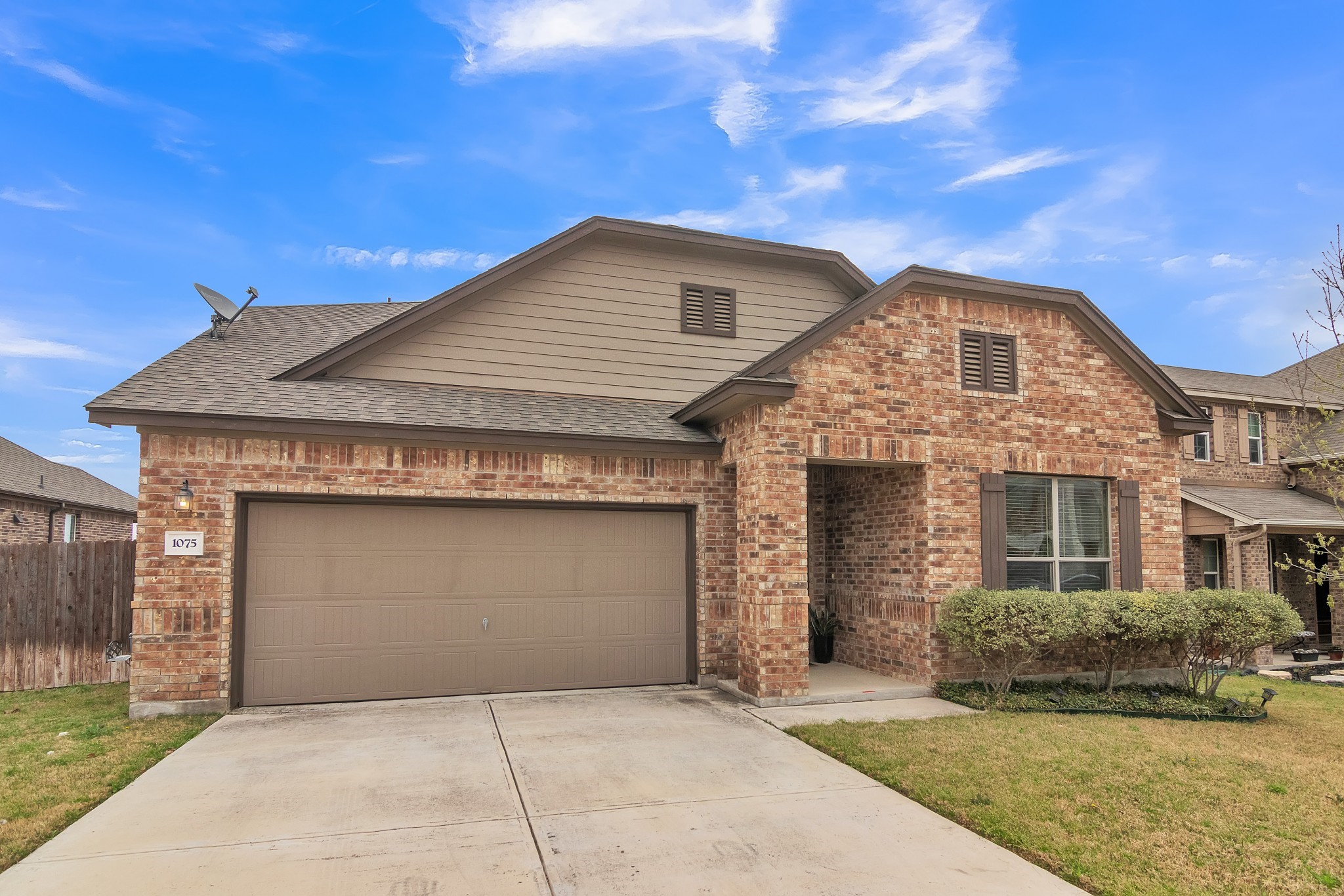 1075 Toltec Trail Georgetown, TX 78626 - Photo 29 of 32 a front view of a house with a garden