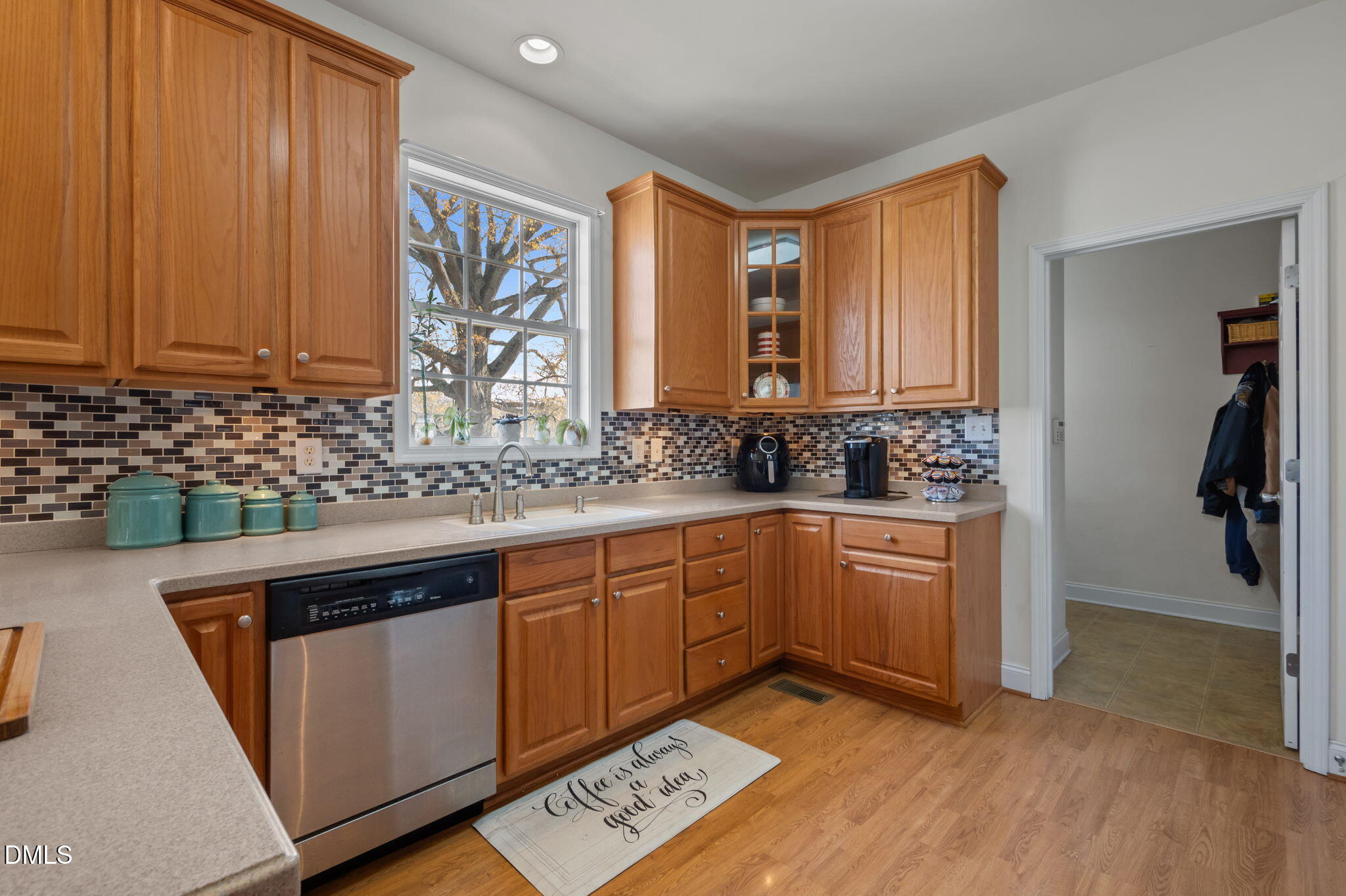 142 Water Front Lane Timberlake, NC 27583 - Photo 10 of 45 a kitchen with stainless steel appliances granite countertop a sink stove and cabinets