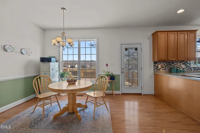 a white bath tub sitting next to a toilet