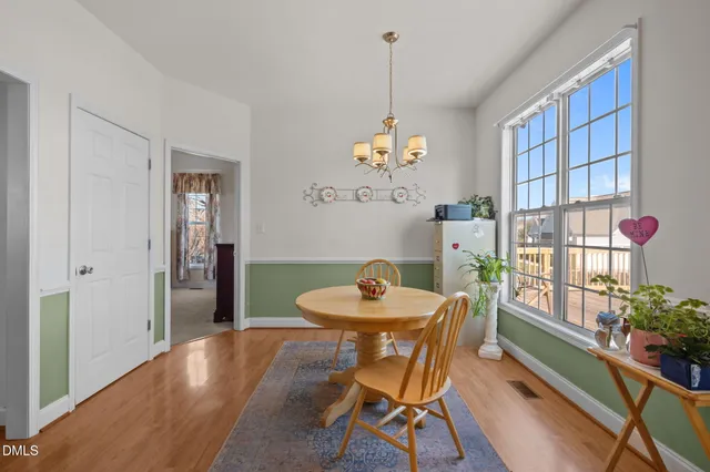 an empty room with ceiling fan and window
