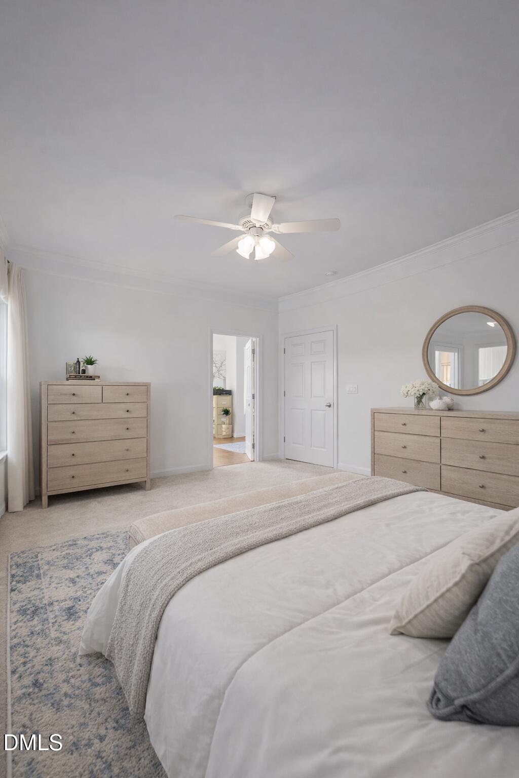 142 Water Front Lane Timberlake, NC 27583 - Photo 15 of 45 a spacious bedroom with a large bed and a chandelier