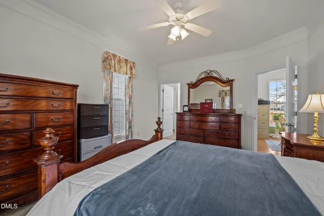 a bathroom with a sink a toilet and shower curtain