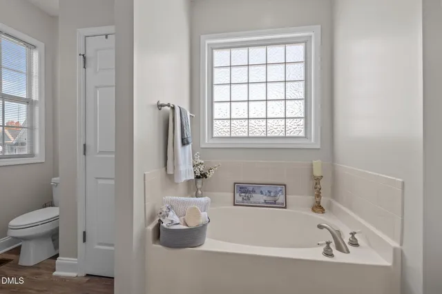 a view of a house with backyard porch and wooden fence