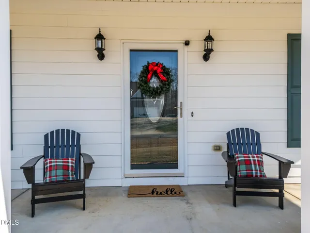 a kitchen with stainless steel appliances granite countertop wooden cabinets a stove top oven a sink and dishwasher with wooden floor