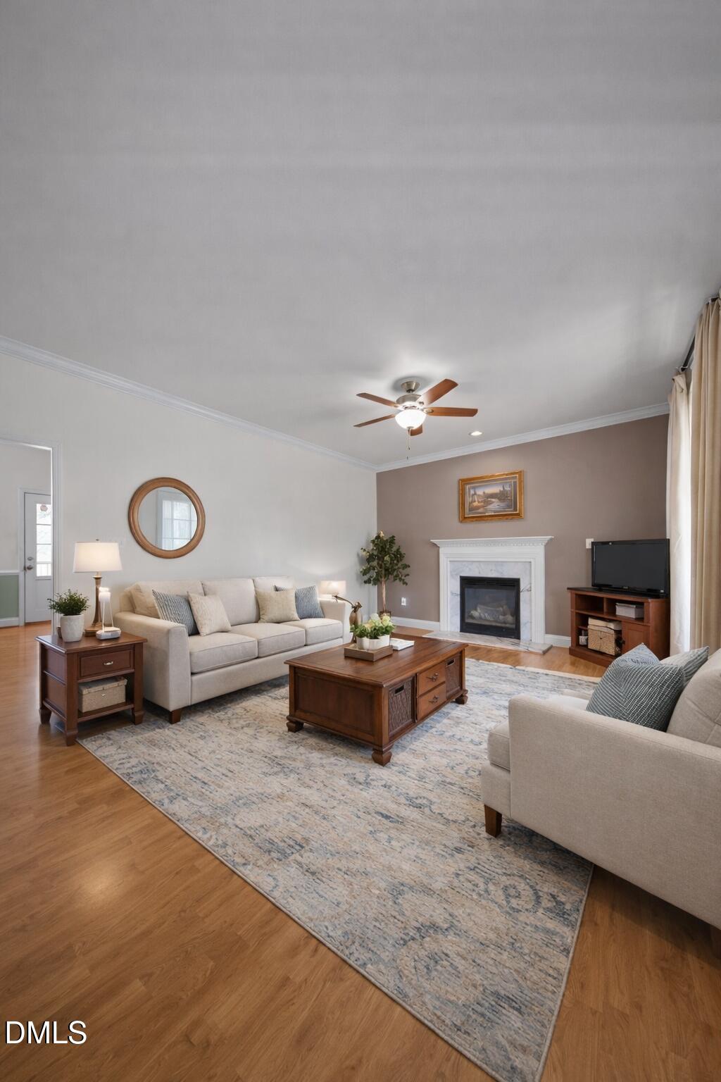 142 Water Front Lane Timberlake, NC 27583 - Photo 5 of 45 a living room with furniture and a fireplace